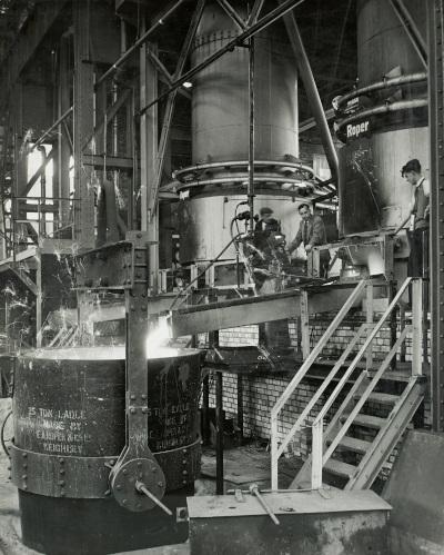 Molten metal being poured from a blast furnace into a 25-ton casting ladle, 1960s (D/Co 12/50/1) - Copyright © Durham County Record Office Molten metal being poured from a blast furnace into a 25-ton casting ladle, 1960s (D/Co 12/50/1) - Copyright © Durham County Record Office