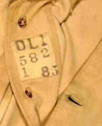 Khaki dress tunic label close-up, DLI no. 1001/1 (courtesy of the DLI Museum) - Copyright © Durham County Record Office. Khaki dress tunic label close-up, DLI no. 1001/1 (courtesy of the DLI Museum) - Copyright © Durham County Record Office.